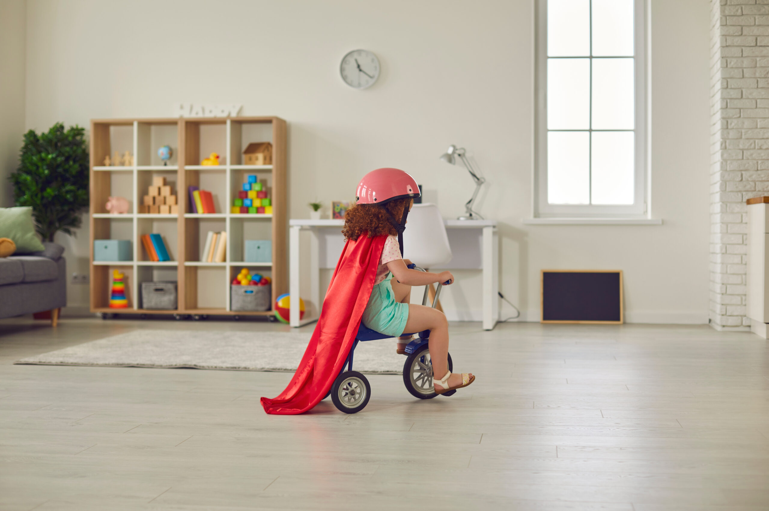 Kid Learning How to Ride a Bike Indoors with Coach Rosa